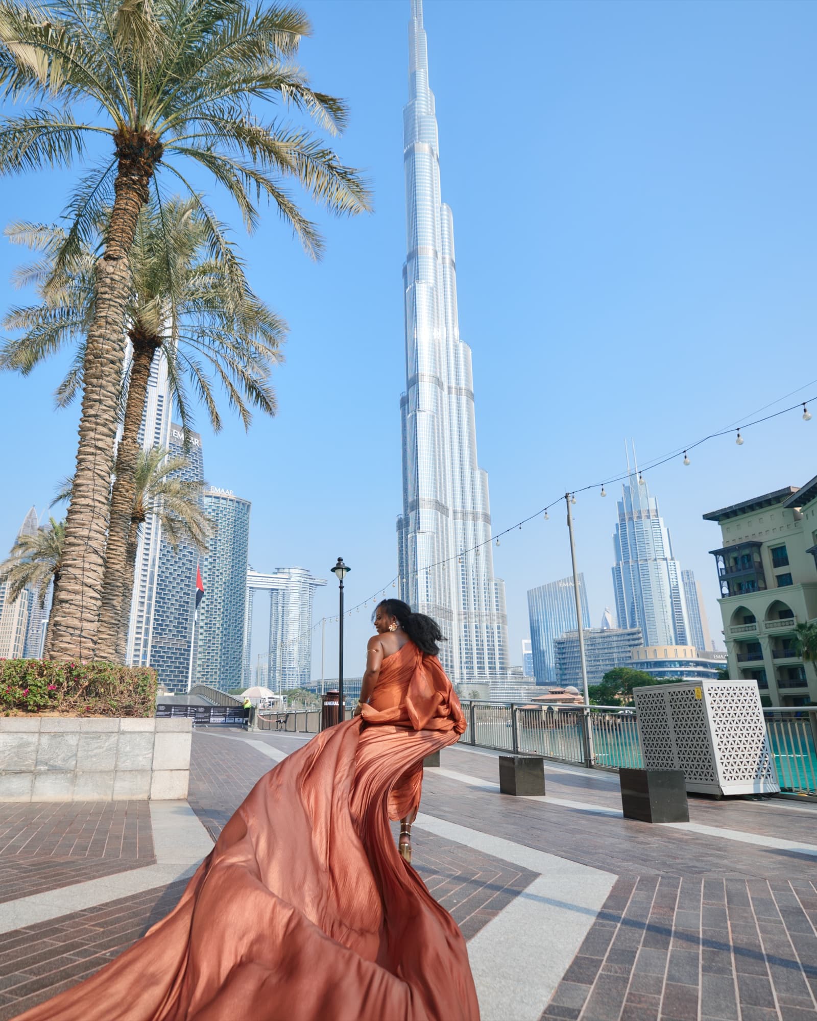 Editorial photography by Deine, Burj Khalifa with a copper flowing dress