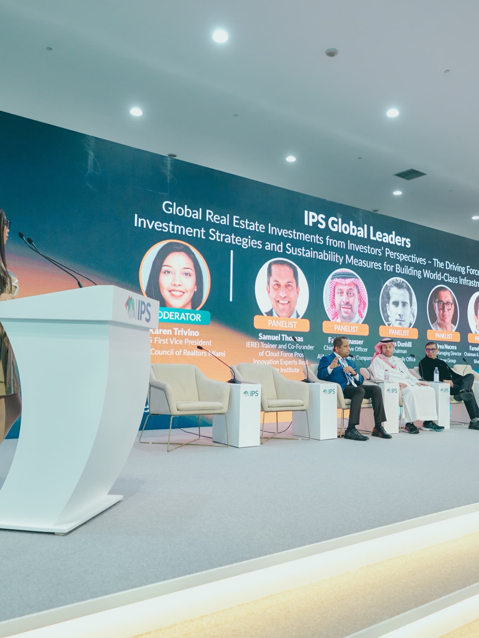 Conference photographer in Dubai capturing a speaker at a podium