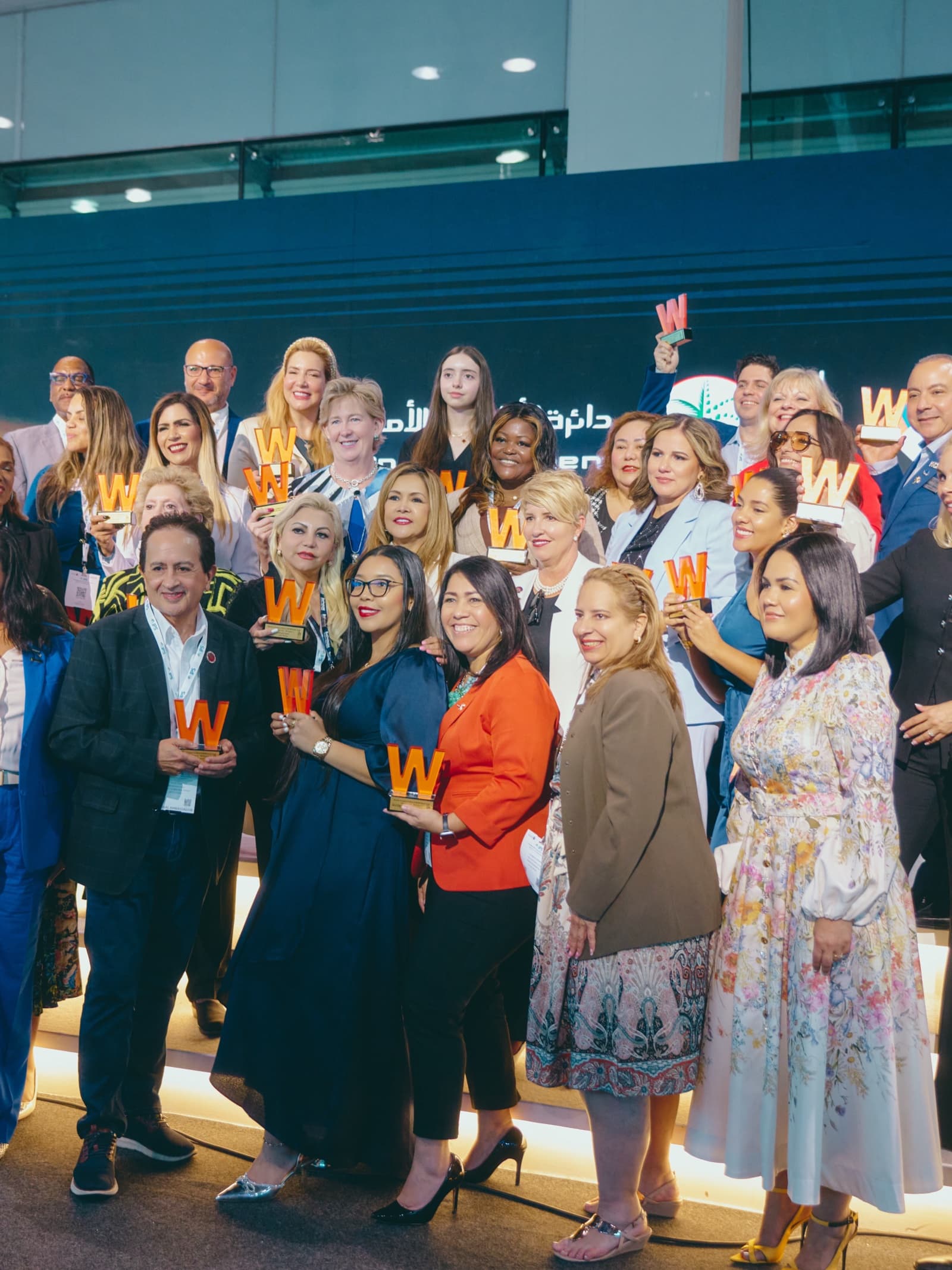 On-stage photography by Deine, award ceremony group portrait