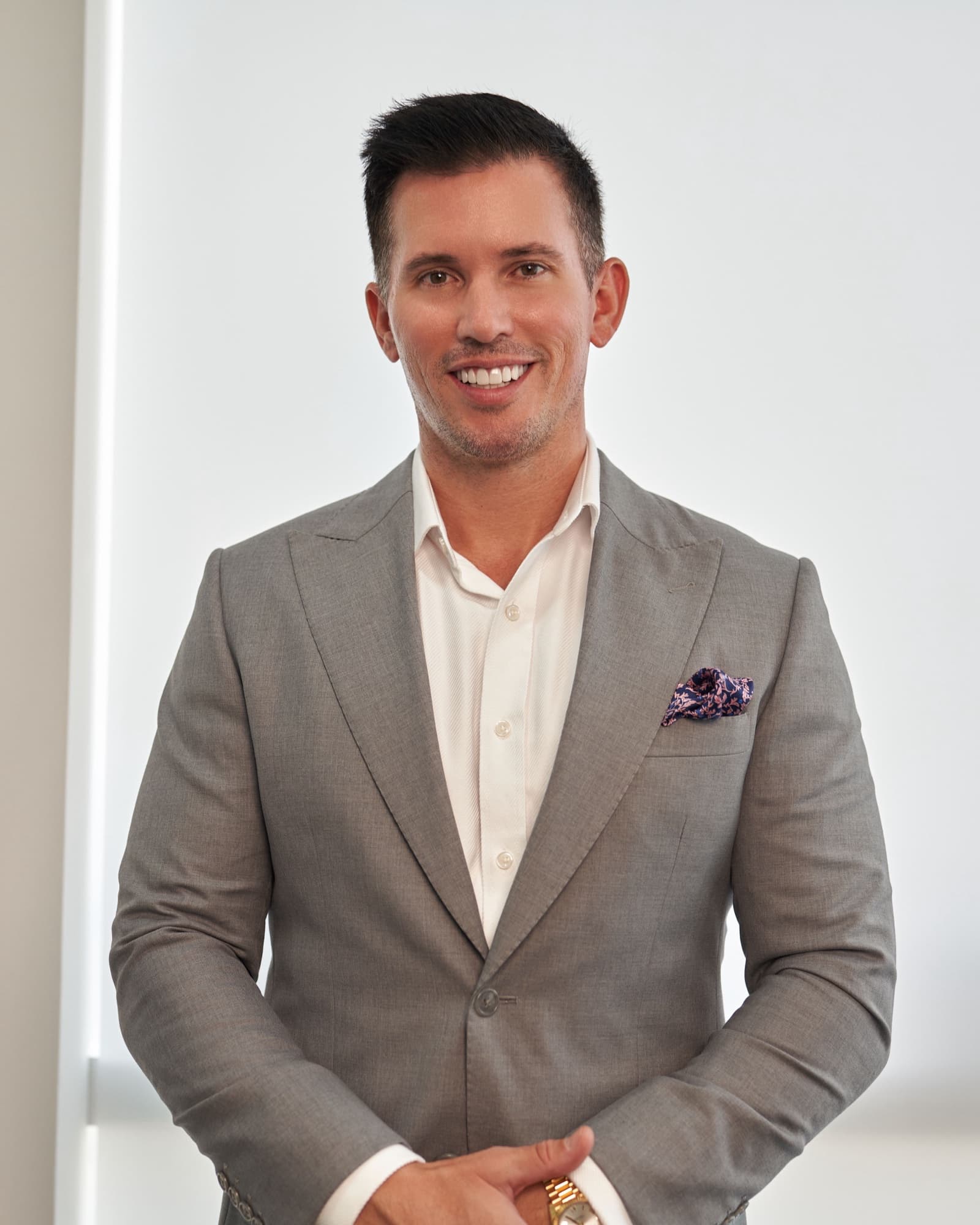 Corporate headshot in Dubai by Deine Photography, executive in a grey suit